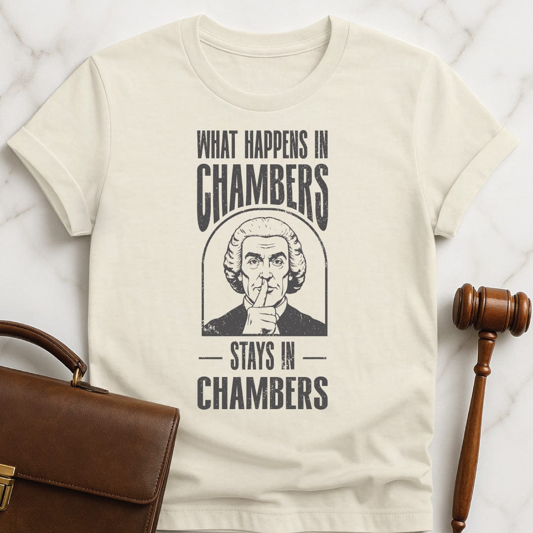 cool law grad t shirt that says what happens in chambers stays in chambers featuring a judge with his fingers to his lips in cream