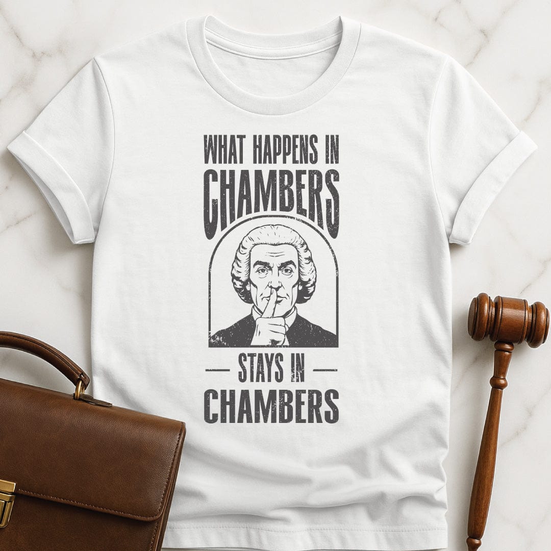 funny law graduate graphic tshirt that says what happens in chambers stays in chambers featuring a judge with his fingers to his lips in white