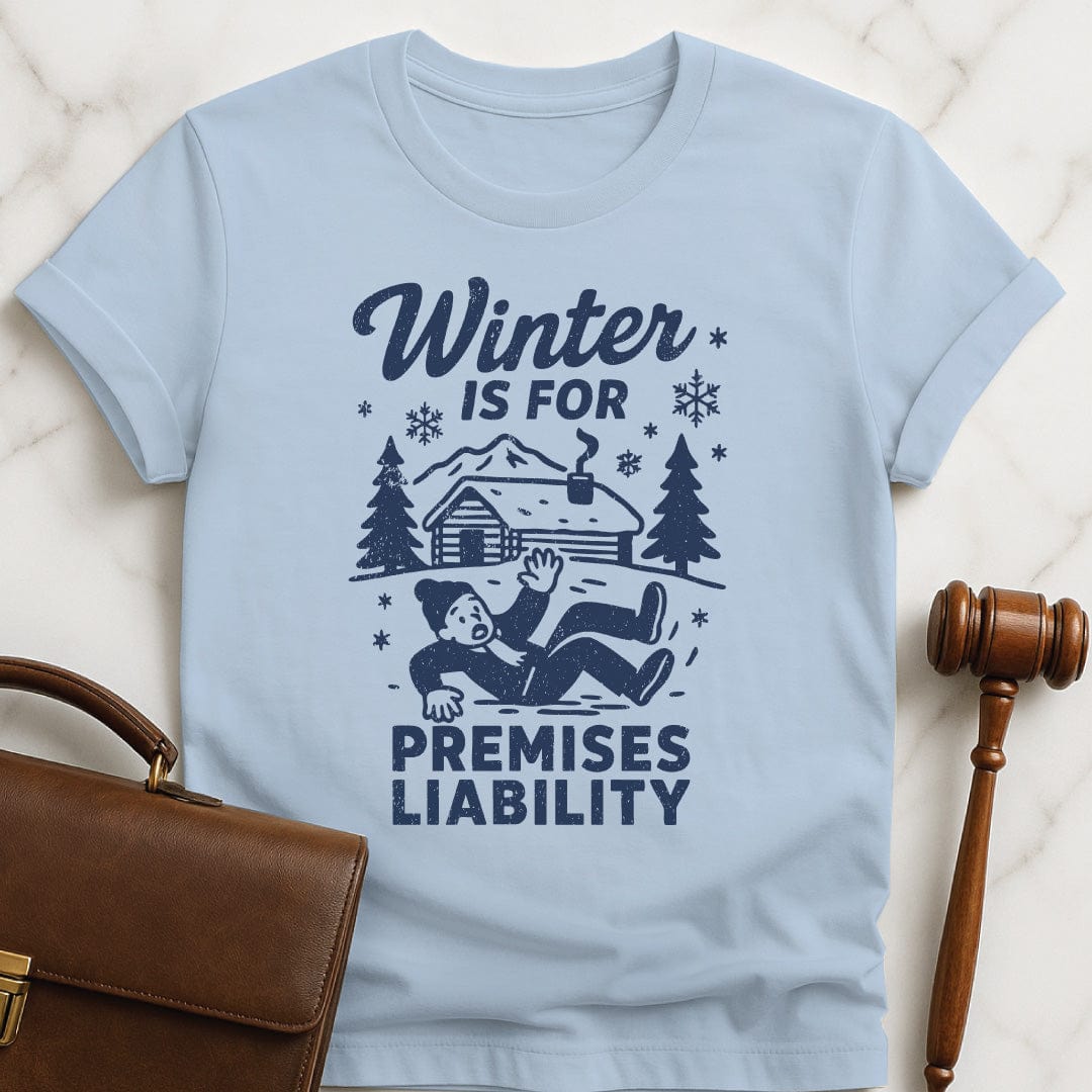 funny attorney graphic tshirt that says Winter is for premises liability featuring man falling on snow in blue