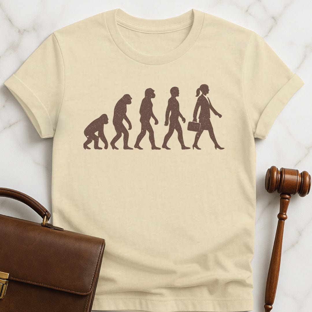 funny lawyer graphic t shirt featuring images of the evolution from monkey to neanderthal to human to lawyer in cream